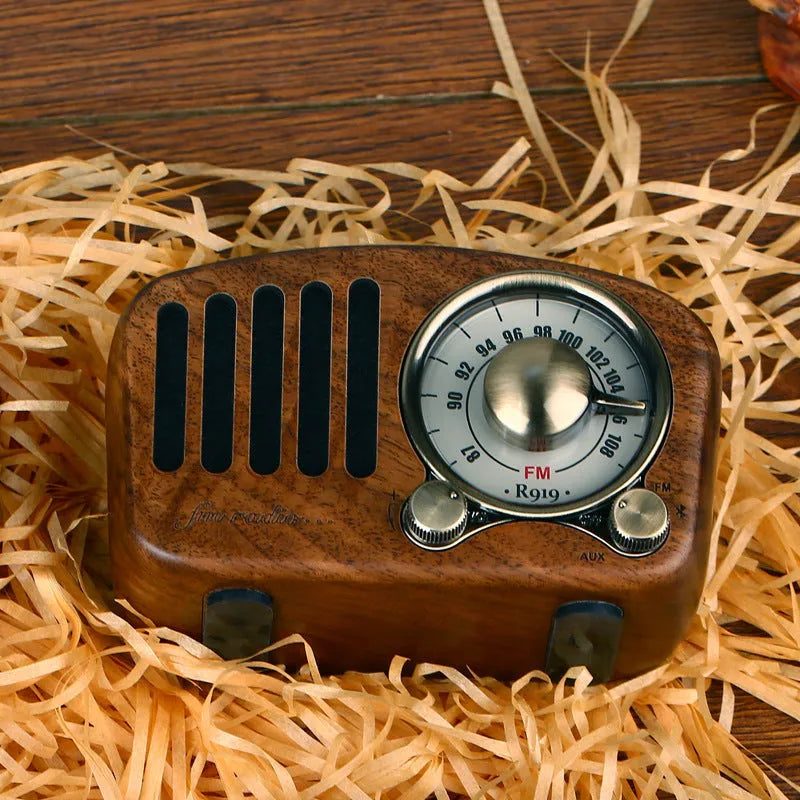 Retro wooden wireless mini speaker in cherry wood finish showing front and side.