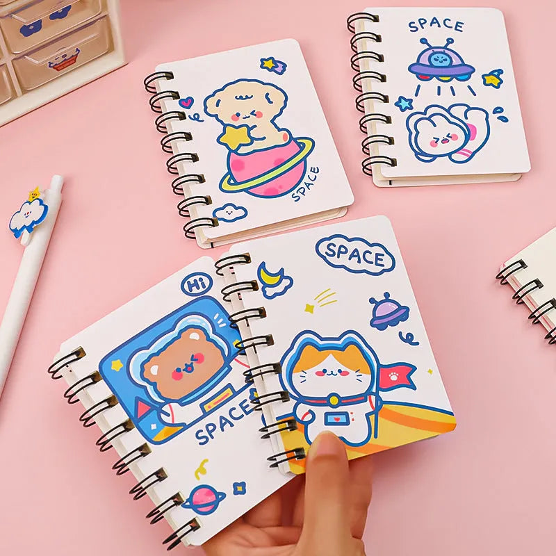 Astronaut themed flipper notebook showing compact 10.5cm by 8cm size with space artwork cover
