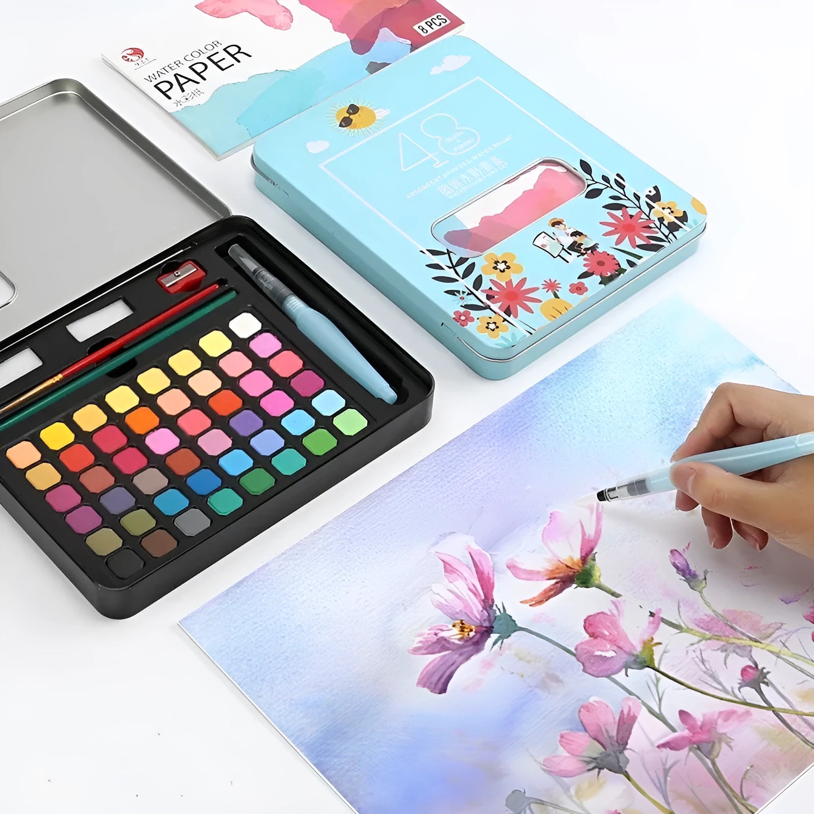 Box of 48 solid watercolour paints in various colours including black, pink, and blue.