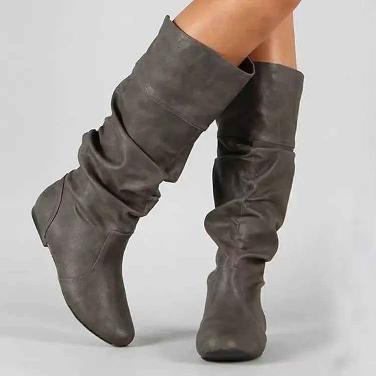 Women's black slip-on flat ankle boots with high shaft and round toe