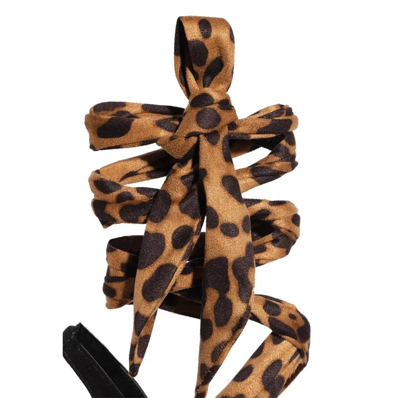 Light brown leopard print Roman style high heels with cross strap design and 8cm heel