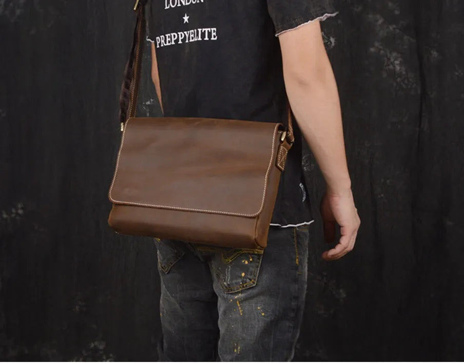 Men's vintage brown leather messenger bag with organised interior compartments and crossbody strap