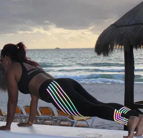 Women's black and white milk silk fitness leggings with glowing print patterns, slim fit full-length design.