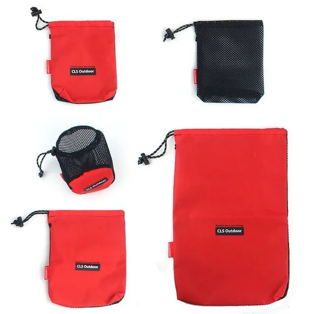 Set of five red outdoor travel storage bags with zippers and mesh panels.