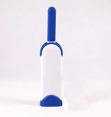 Blue reusable pet hair removal comb with double-sided flannel brush and self-cleaning base for sofas.