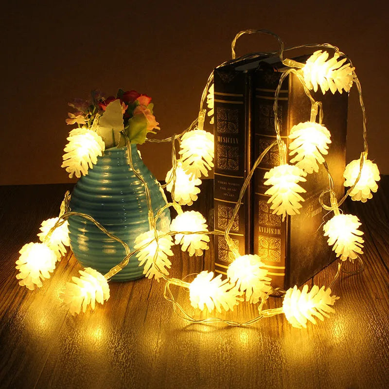 Battery-powered warm white LED pine cone light string for decorative indoor and outdoor use
