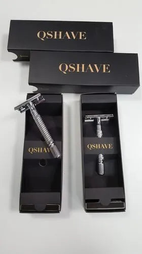 Double edged safety razor with blade and storage box on white background