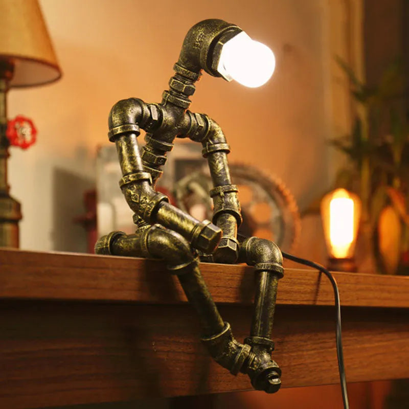 Vintage industrial robot table lamp with iron pipe design and water pipe light filtering