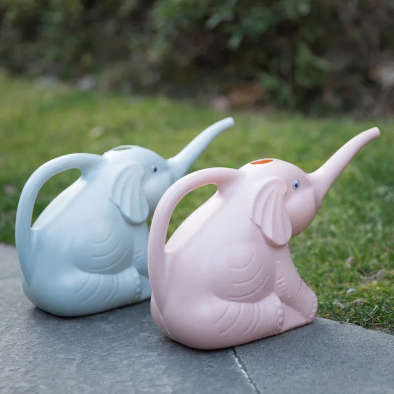 Pink children's watering can in shape of baby elephant with long nozzle and handle.