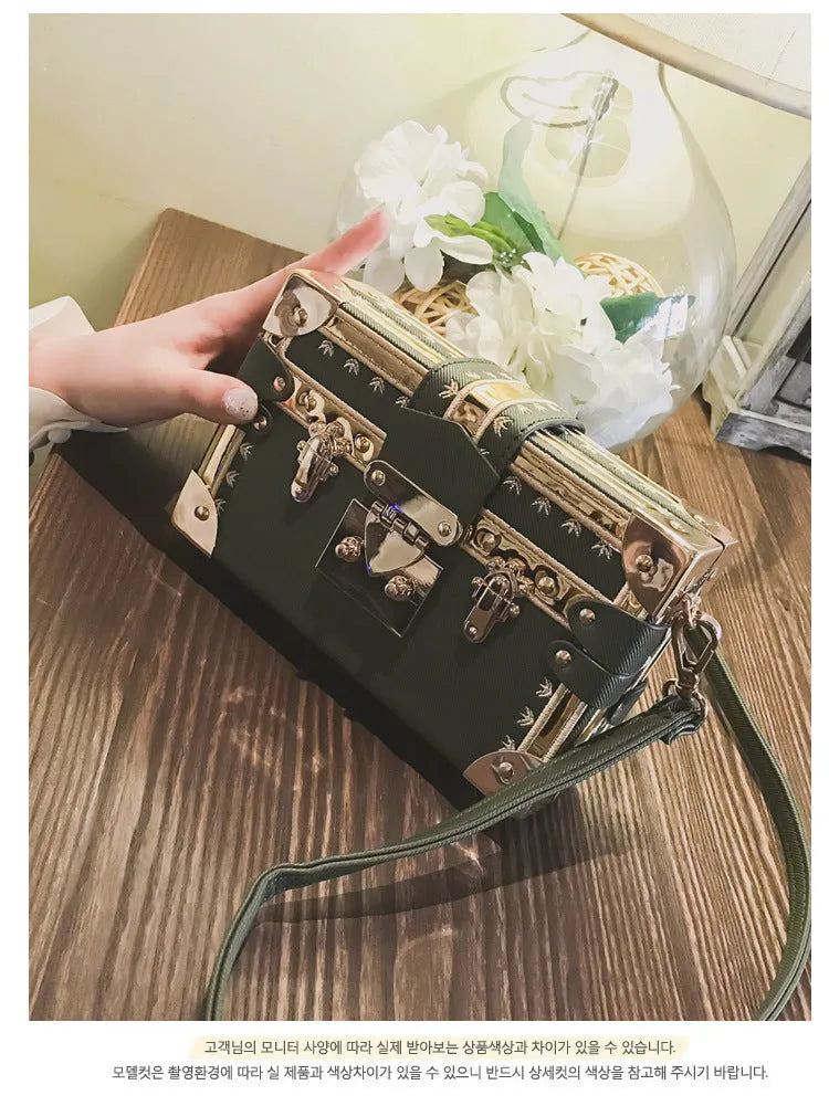 Women's black PU leather shoulder bag with flap closure and adjustable crossbody strap