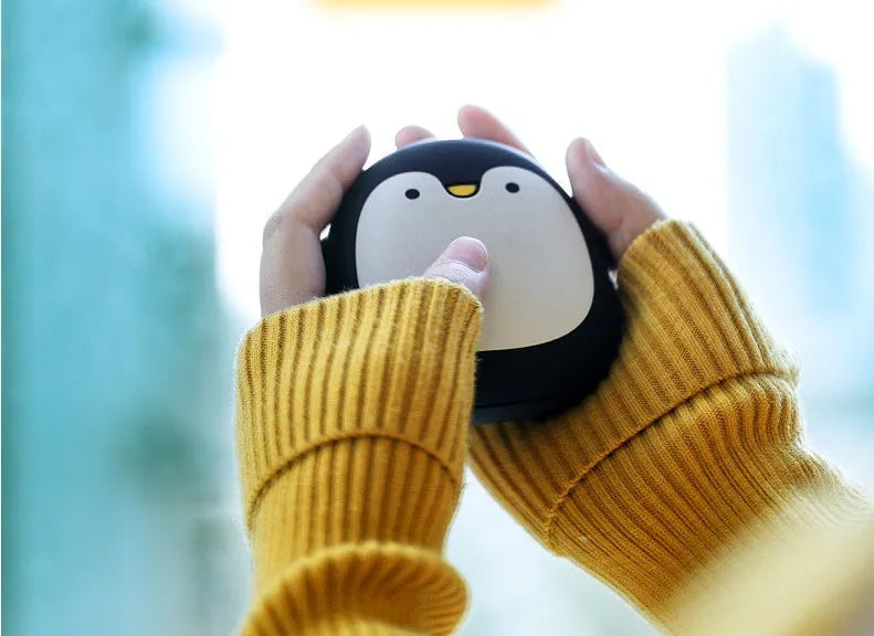 Cartoon penguin and polar bear USB rechargeable hand warmers showing front design