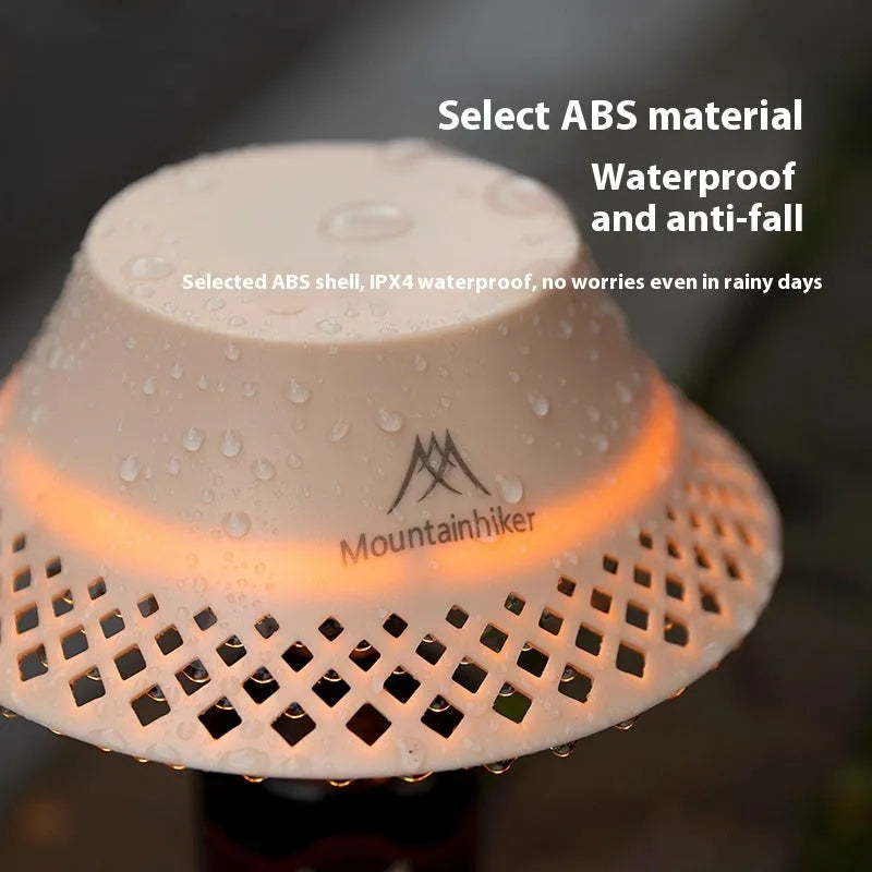 Beige wine bottle-shaped camping lantern showing three light mode settings and USB-C charging port.