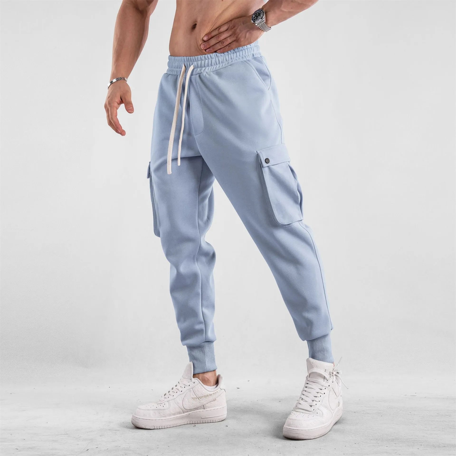 Men's loose cotton trousers with ankle tie fastening and multiple pockets in six colour options