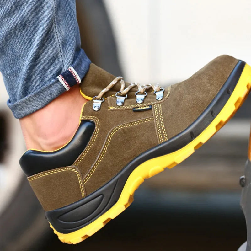 Bronze cow suede leather steel toe safety boots with non-slip sole on workplace surface