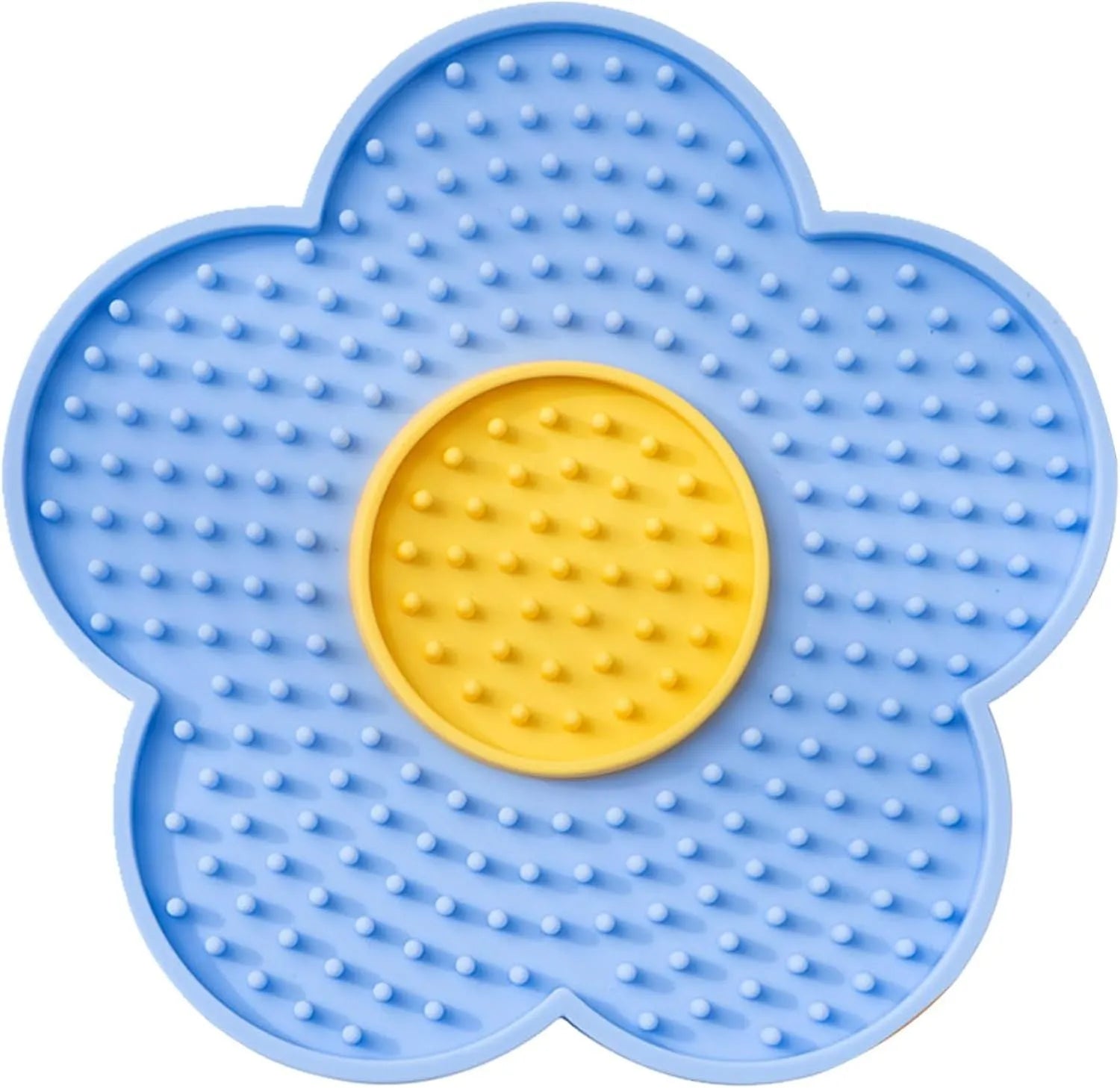 Flower-shaped blue silicone dog licking mat with suction cups on a smooth tile surface.
