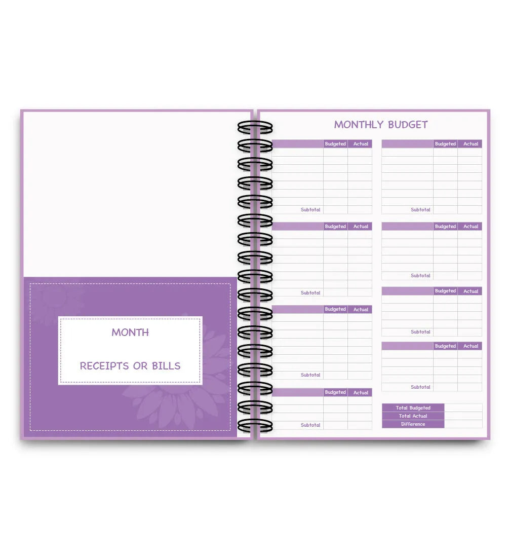 Purple A6 coil-bound budget notebook with pen and financial planning accessories