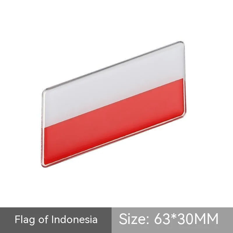 Aluminium metal car sticker with national flag design in a parallelogram shape.