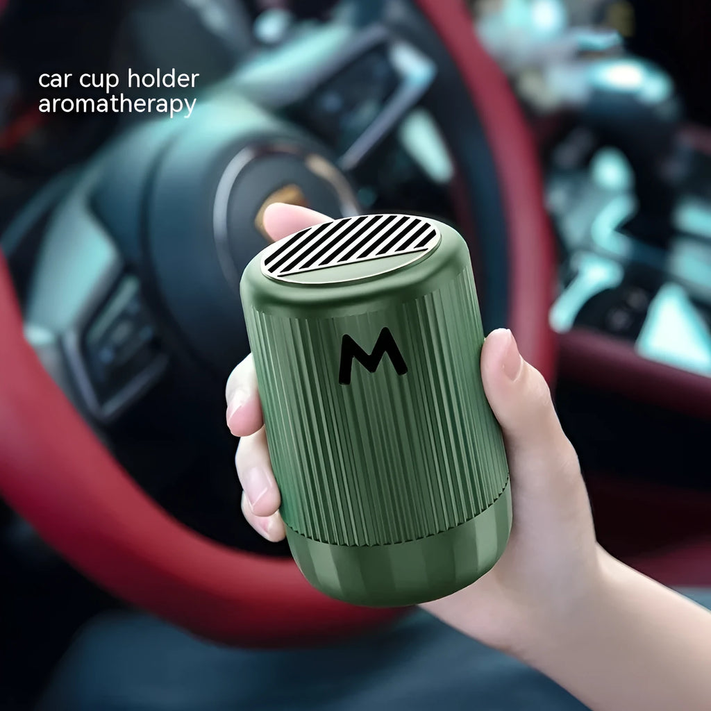 Solid car aromatherapy cup in choice of four fragrances on a 10cm by 6cm base.