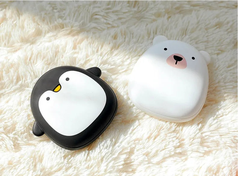 Cartoon penguin and polar bear USB rechargeable hand warmers showing front design