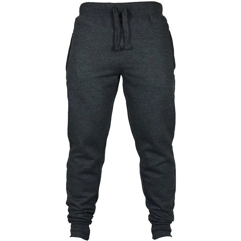Men's black cotton fleece drawstring jogger pants laid flat, showing loose fit and flat front design.