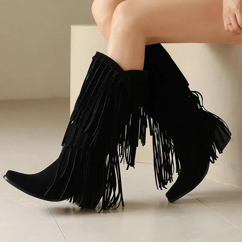 Women's beige suede knee-high boots with tassel, chunky heel, and square toe on a waterproof platform.