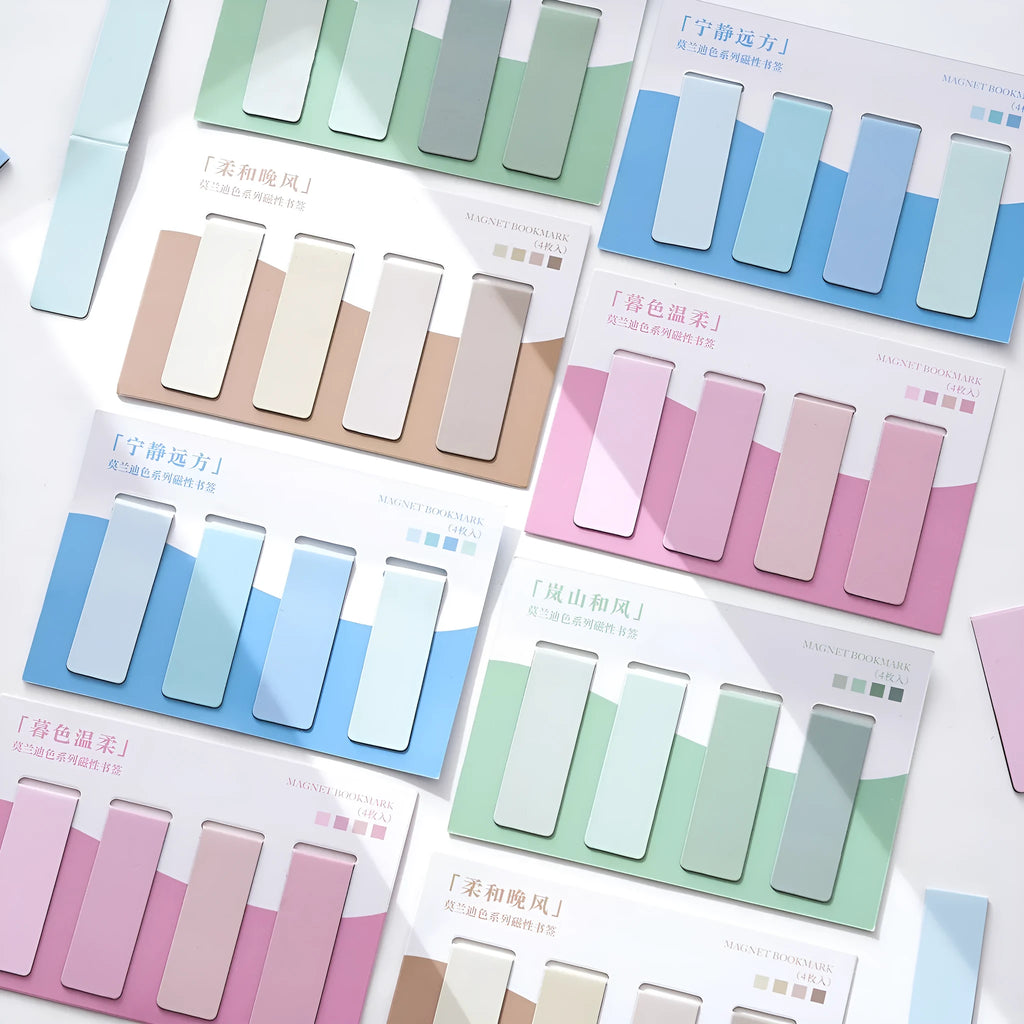 Set of four Morandi Series colour block magnetic bookmarks in pastel shades on a book page.