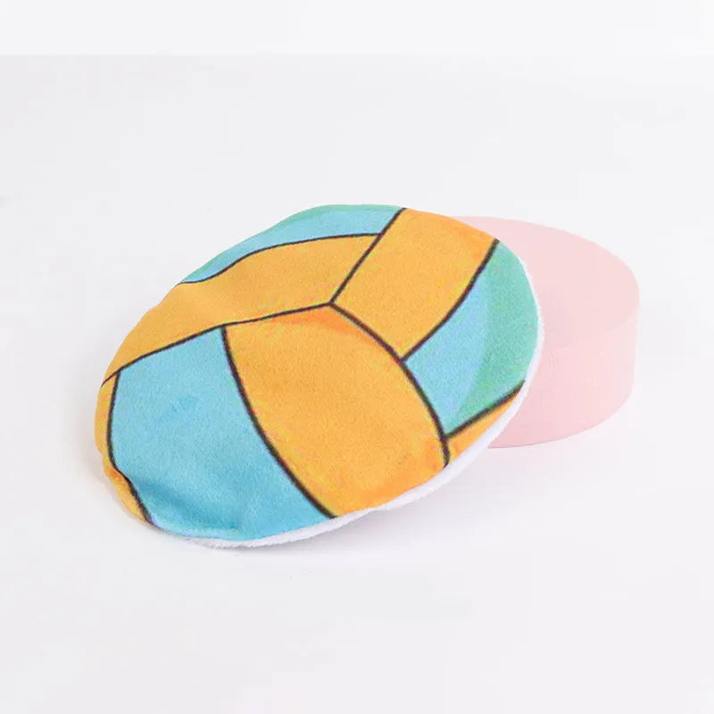 Plush disc cat toy with sports ball pattern containing catnip and crinkle layer