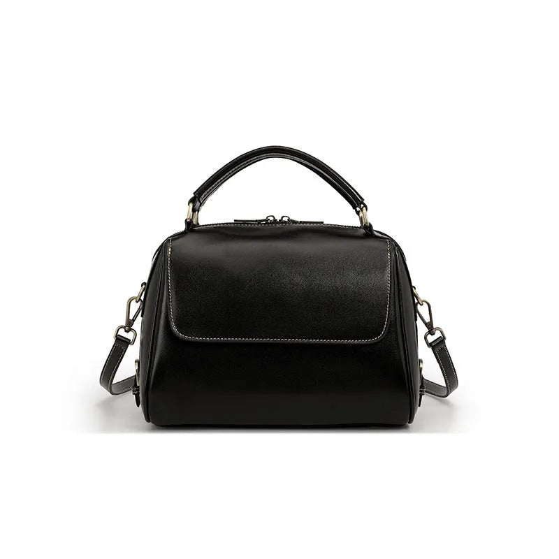 Women's genuine leather crossbody tote bag in apricot colour showing internal compartments and shoulder straps.