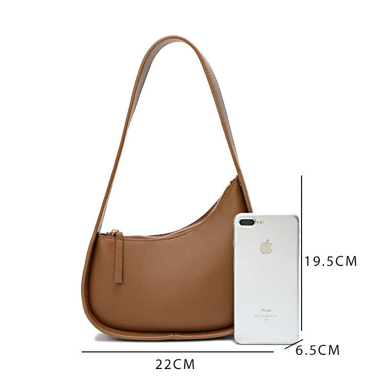 Genuine leather half moon women's handbag with wide shoulder strap in caramel colour