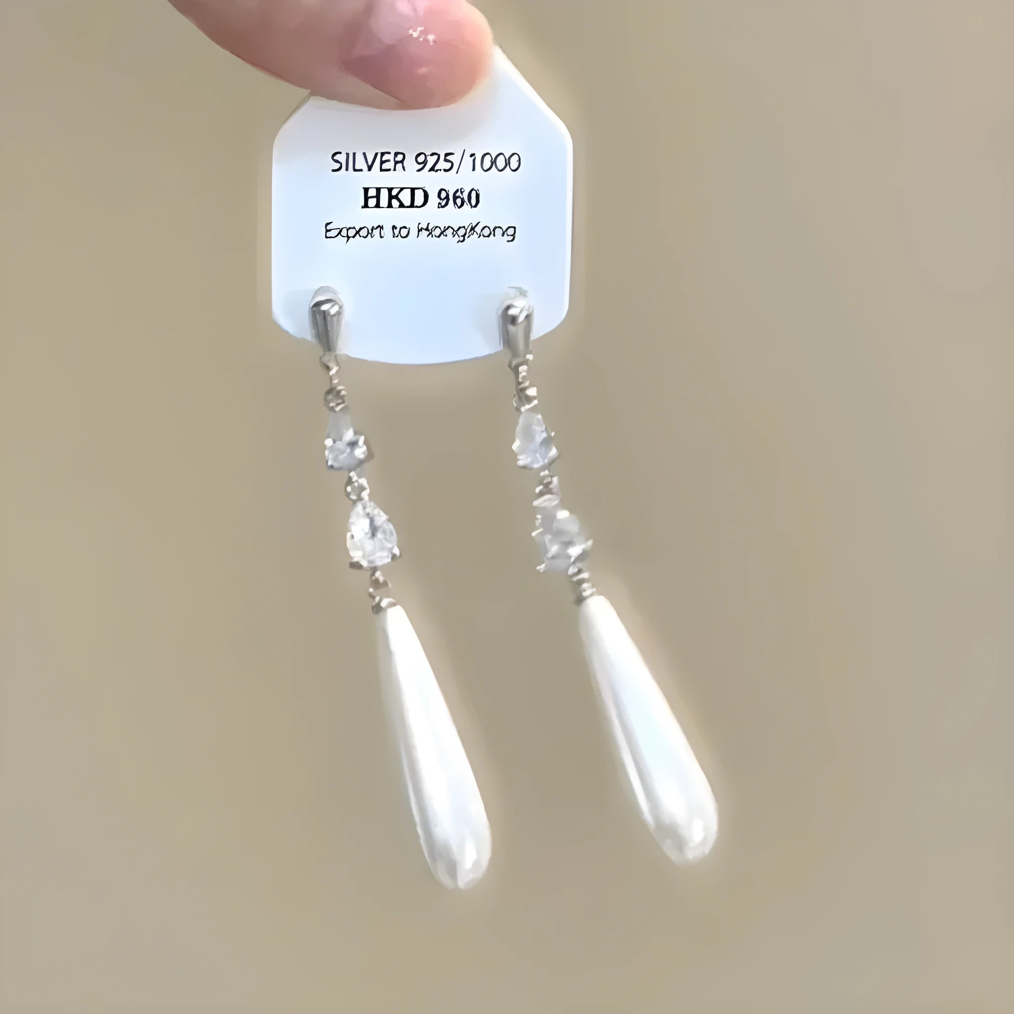 Alloy geometric heart ear clip with rhinestones and a star tassel, shown in a light luxury fresh style.