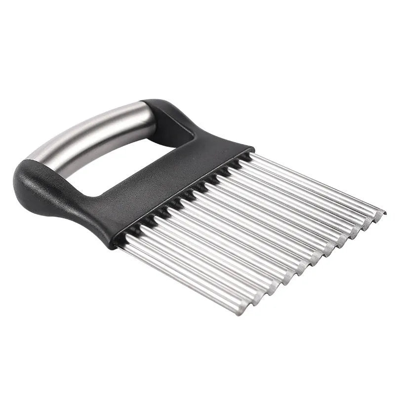 Stainless steel potato wave knife on a kitchen counter, showing its crinkle cut blade and compact 14 cm size.