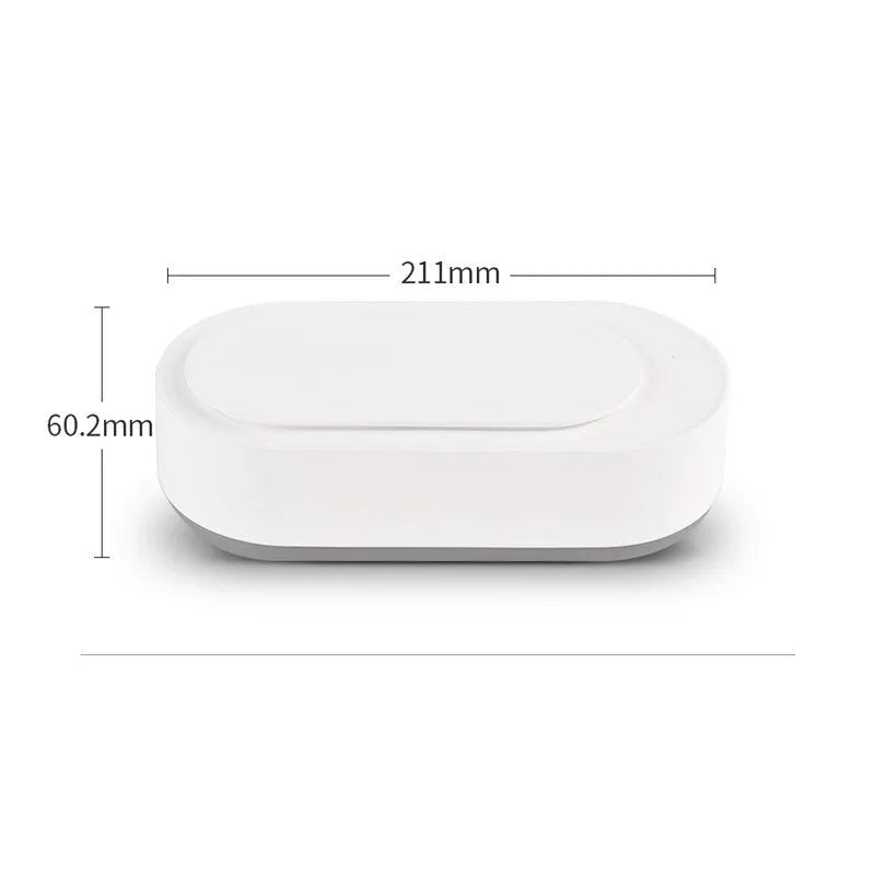 White portable ultrasonic cleaner machine with stainless steel tank for cleaning jewellery and glasses.