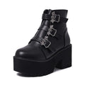 Black women's punk style ankle boots with bat buckle and side zip.