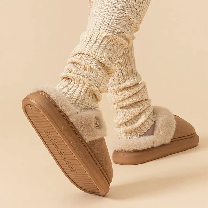 Fleece indoor slippers with thick PVC soles in various colours showing car stitching detail