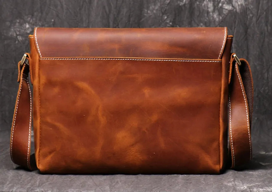 Men's vintage brown leather messenger bag with organised interior compartments and crossbody strap