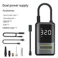 Black handheld digital wireless air pump with LED display and connected air hose on a grey background.