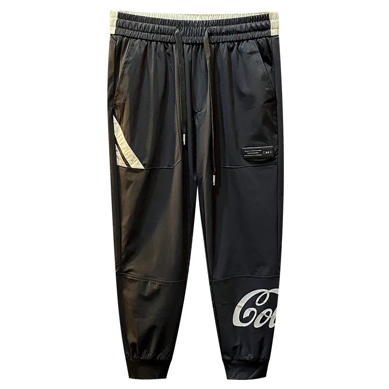 Black men's cropped casual trousers with ankle band, made from ice silk cotton fabric.