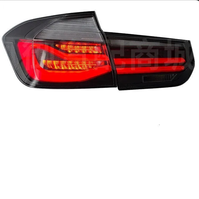 BMW 3 Series red and smoked black LED tail light assembly showing streamer design