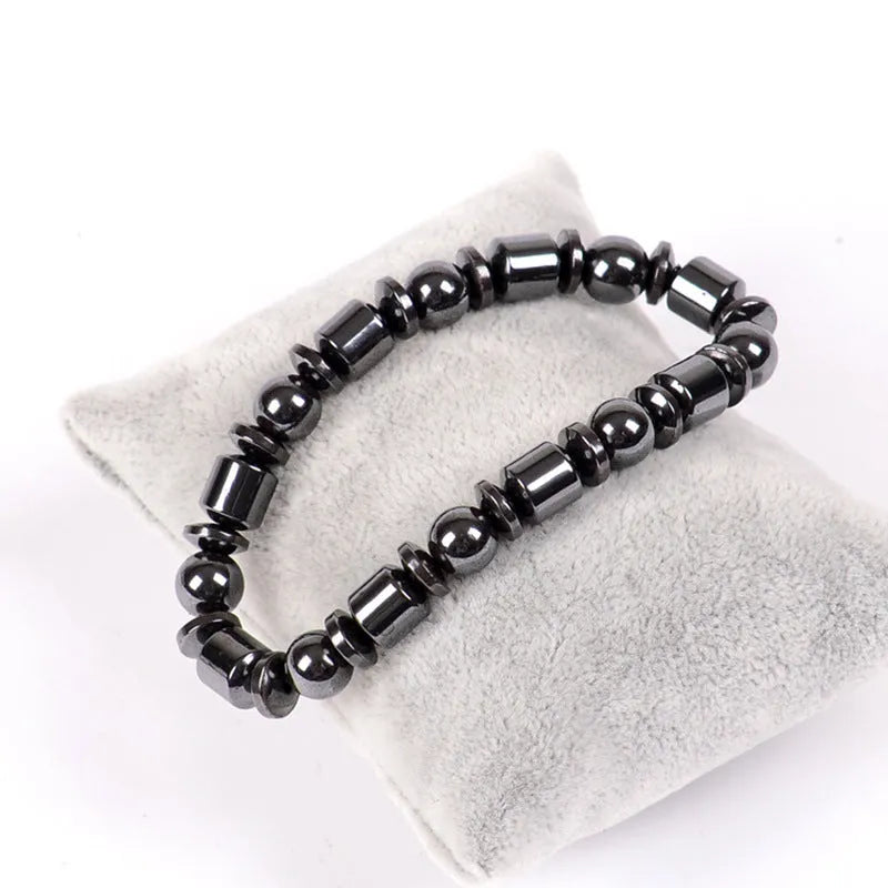 Black stretch bracelet with a pentagram design made from magnetite and hematite stones.