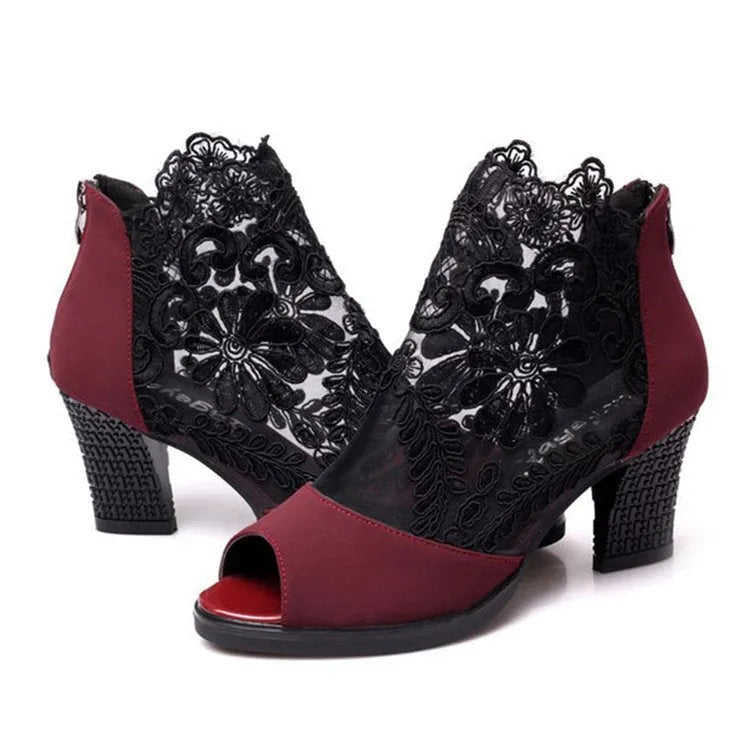 Women's black lace gladiator sandals with square heel and zip closure showing floral patterns