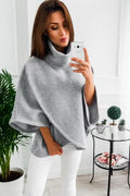 Women's long black cardigan sweatshirt with batwing sleeves and stitching detail, shown as a faux two-piece.