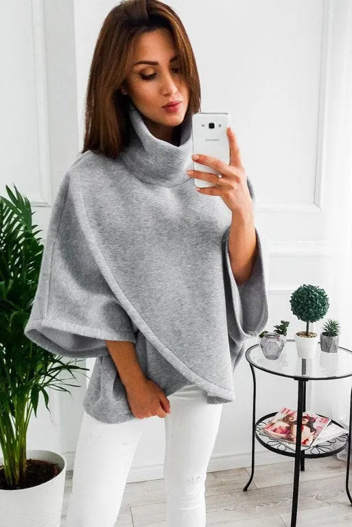 Women's long black cardigan sweatshirt with batwing sleeves and stitching detail, shown as a faux two-piece.