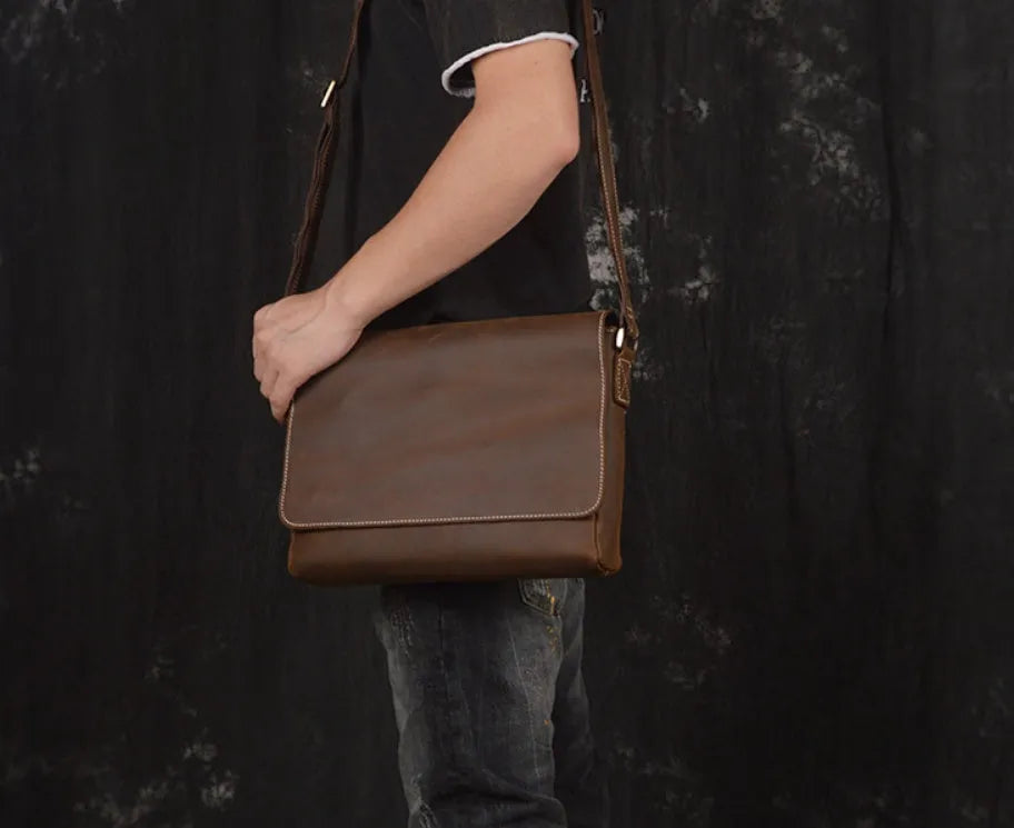Men's vintage brown leather messenger bag with organised interior compartments and crossbody strap