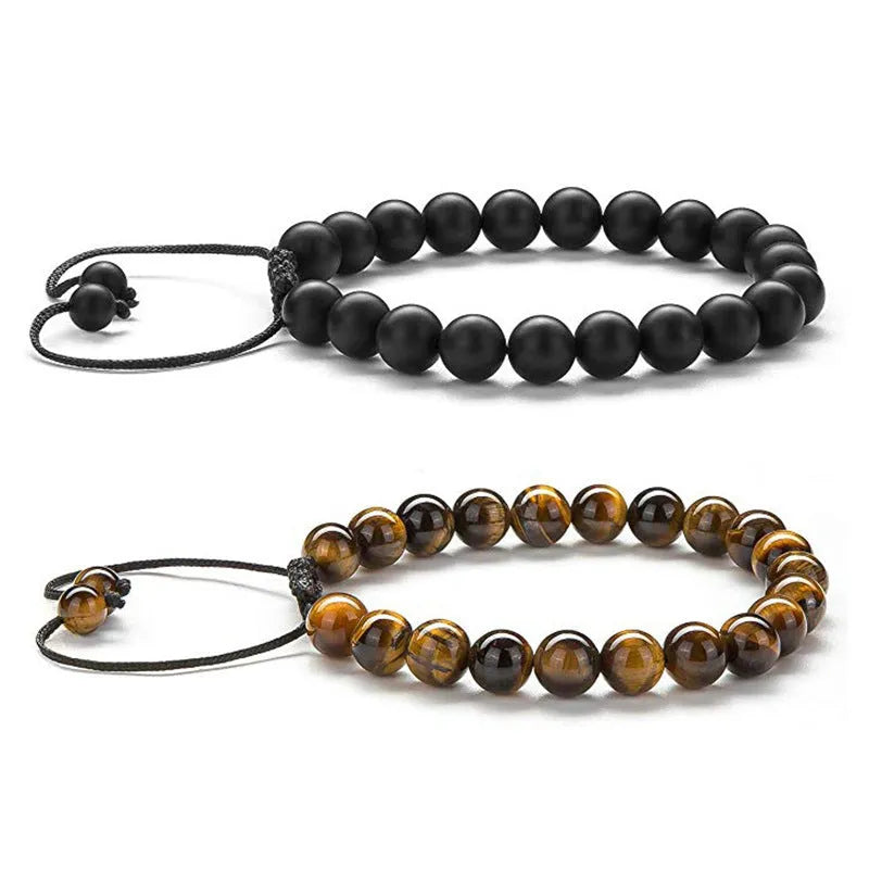 Pair of matte black agate bead bracelets with geometric design for couples.