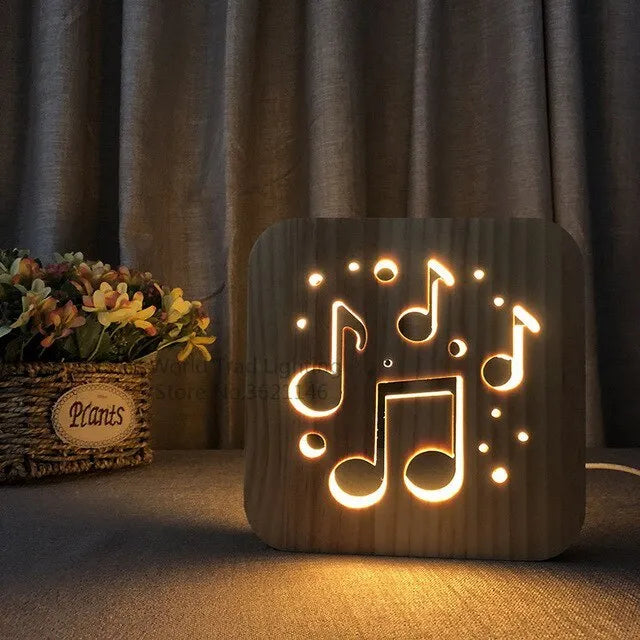Square wooden LED atmosphere lamp with warm white light and USB cable on a desk