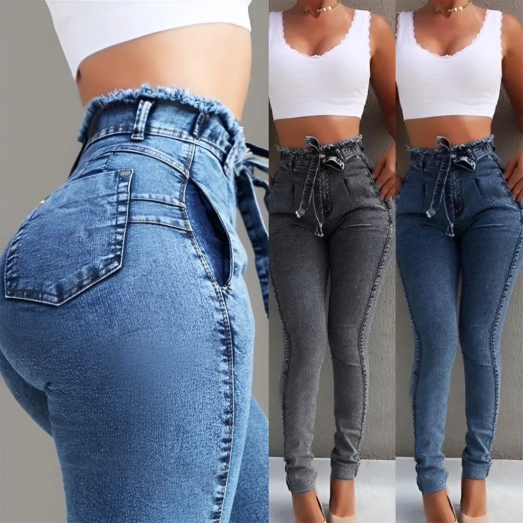 Pair of women's light blue straight-leg jeans with a frayed, distressed hem detail.