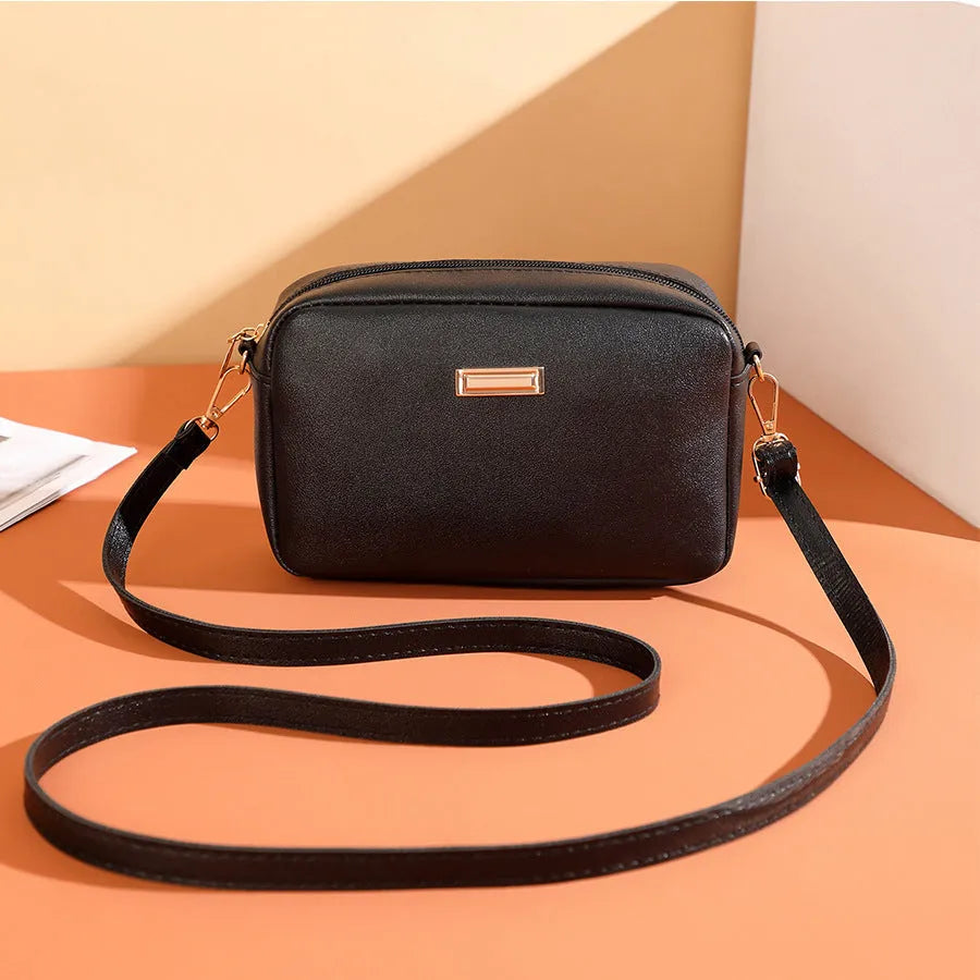 Women's solid colour PU leather shoulder bag with three-dimensional pockets in urban simplicity style