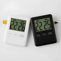 Magnetic kitchen timer with LCD screen showing time display, available in black and white colours