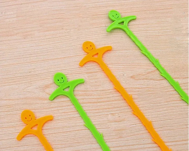 Orange colour kitchen pipe dredging hook made from soft PP, 51 cm long, with a smiling face design
