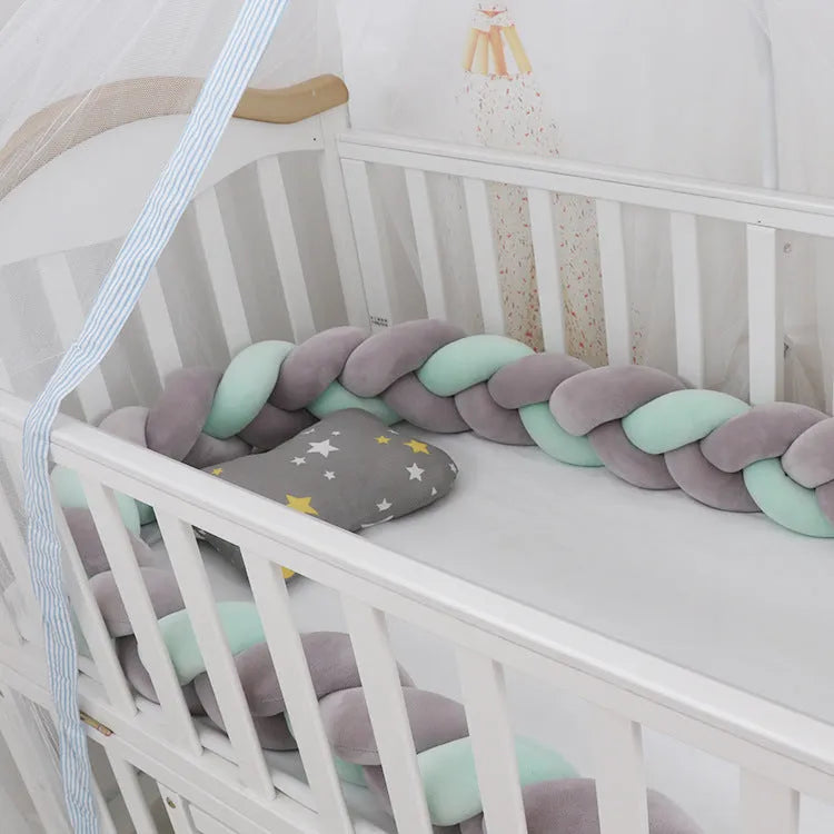 Soft spandex velvet baby crib bumper protector shown in a light grey colour, shaped around white crib bars.